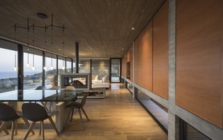 The living room, dining area, and kitchen have been designed as a single space within the main level. 