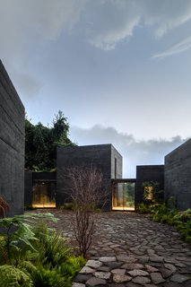 The walkways provide access to the patio and the landscape beyond the property, offering views along the way.