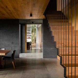 There is a studio space on the upper level of one of the volumes, above the dining area.