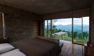 The guest rooms are located within chalet buildings that are scattered across the two-acre site, with each chalet split into two levels with one room on each. 
