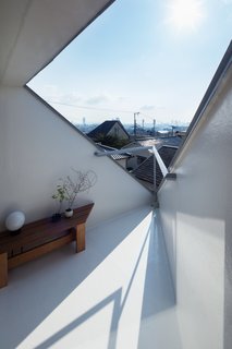 A corner is used as an outdoor terrace.