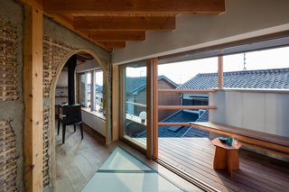 An outdoor deck on the upper level looks down to street views.