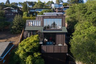 As part of the most recent renovation, eco-friendly features such as solar panels and a car charging station were added, but the home's midcentury details were kept well intact. 