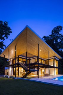 The terraces create such a strong sense of being outside that the house has practically become a part of the natural world. 