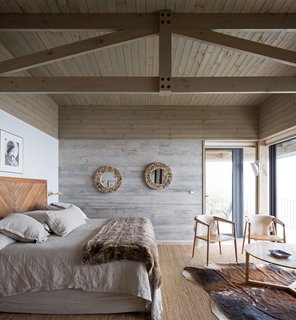On the opposite end of the pool is an ensuite bedroom that is connected to a smaller, corner terrace.