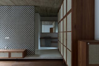 The hopper motif is repeated in interior details such as door handles, wall tiles, and sinks.