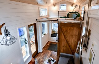 The nook seat serves as a toddler sleeping surface. With the additional space, there is now enough room for a desk, toy boxes, clothes storage, wall shelving, etc. The main living area is directly outside this room.