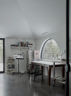 A "light cannon" illuminates the studio, while massive east-facing skylights point light toward the lime-covered vertical veils.