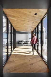 A glass bridge connects the old house to the new house.