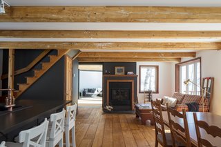 The new addition looks like a refined, modern version of the existing house, which is more than 50 years old. 