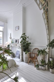 The kitchen opens out to a bright garden, and the master bedroom overlooks the streets.