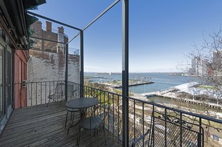 The three-bedroom, two-bathroom flat has several outdoor terraces that look out to panoramic views of Manhattan, the Brooklyn Bridge Park, and the Statue of Liberty.