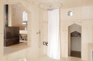 The planks are nailed vertically to the framework of the chalet, as well as its interior walls.