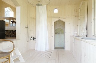 Grooved and ridged versions of the same type of Fir planks have been used to clad the joists to become the ceiling and the floors. 