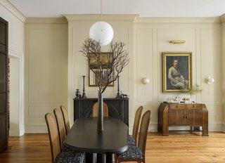A Lawson Fenning Rough dining table by Collection Particulaire and Milo Baughman caned chairs with BBDW fabric complete the look of this room.