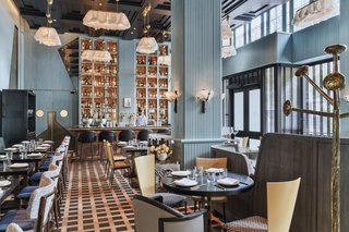 The intimate dining room is furnished with elements from an array of modernist styles.