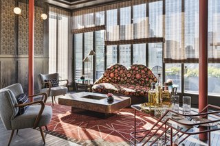 Luxe furniture by designers such as Jean Royere, Gio Ponti, and Adolf Loos inspired the unique look of the hotel’s rooftop lounge.