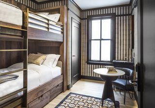One of the rooms features stylish bunk beds, which are perfect for kids.