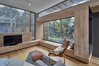 The eco-friendly home is equipped with rainwater harvesting, hydronic heating, and a compost and vegetable garden.