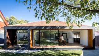 "We immediately knew the best method to bring value through design would be to remove the lean-to," says Ong. His solution was to pull open the rear façade and alter the relationship between the existing spaces with the garden outdoors. 