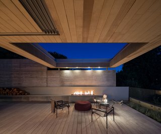 The house is supported by concrete walls at the edges of the house, and with steel beams running east to west. This creates a clear span in the house and across the deck.