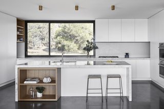The kitchen features a lovely CDK stone backsplash.