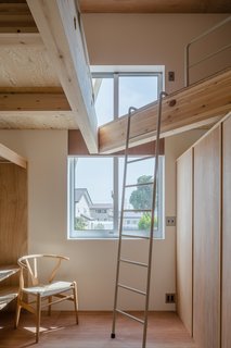 The 3,988-square-foot house has an angled roof that fits loft-like platform spaces.