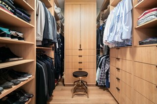 The master bedroom also includes a large walk-in closet that is clad in the same oak millwork as the living room. 