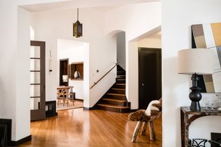 The commodious living room features soaring ceilings that are over 12 feet high.