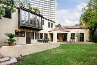 The residence is hidden behind an expansive wall, offering its owner plenty of privacy.