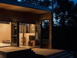 The north-facing terrace serves as an informal main entrance that leads to a grilling area, and on to the kitchen and dining spaces.