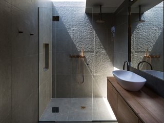 A skylight brightens the shower area.