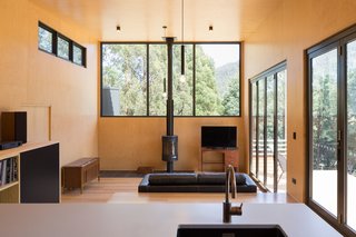 The shallow plan helps with cross ventilation, while a deep overhang to the north provides shade for the living areas in the summer.