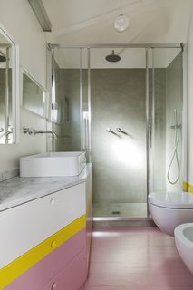 Cheerful, upbeat colors have been chosen for the kids’ bedroom and bathroom.