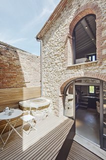 The living room on the ground floor had an original floor area that follows the form of an imperfect square.
