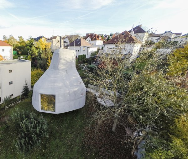 The steepness of the site inspired architect Jan Šépka to raise the house by resting it on top of a single, stalk-like concrete column.