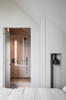 Concrete has been used for the bathroom floor and shower tray.