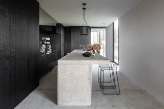 The contemporary guest kitchen has been designed and built by Danish brand VIPP.