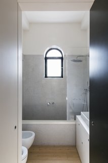 Dotted mosaic tiles by Fornace Brioni have also been used for the daughter’s bathroom.