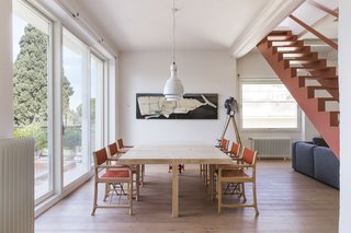 Next to the living lounge is a large dinning area that leads out to a balcony.