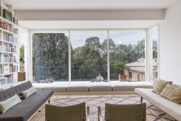 Expansive windows have been installed to flood the house with sunlight and capture sweeping views of the park outside.
