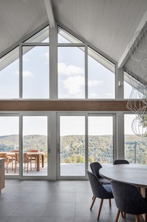 Hope stripped the house, but retained the foundations and frame. This allowed her to open the property up to the view of the valley by using fully-glazed doors.