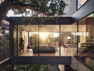 Floor-to-ceiling glass walls on both sides of the main living room allow sweeping views straight through the house.