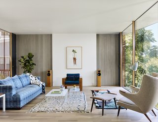 The kitchen and living area are connected to a small sun-drenched balcony.
