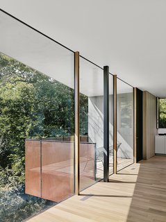 Two Bertoia Diamond chairs on the balcony.