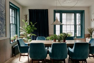The walls were covered in raw lime plaster, and modern, flush paneling in rough, cross-sawn limed oak wraps around the interior walls to form cabinets, doors, and dado rails. 