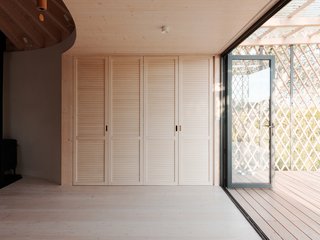 A kitchenette is concealed within a closet.