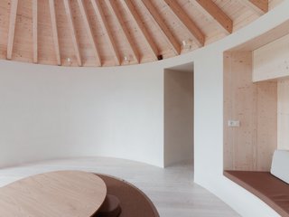 Jurkovič created built-in alcove seating in the main room to maximize the usable floor area.