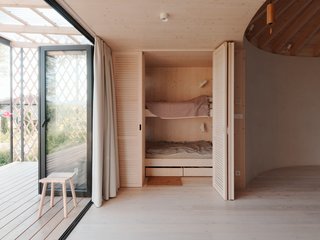 On the opposite side of the kitchen are two bunk beds that can be tucked away.