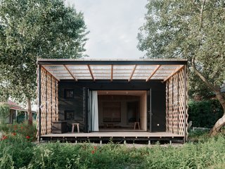 The circular yurt-like interior is set within a square envelope.